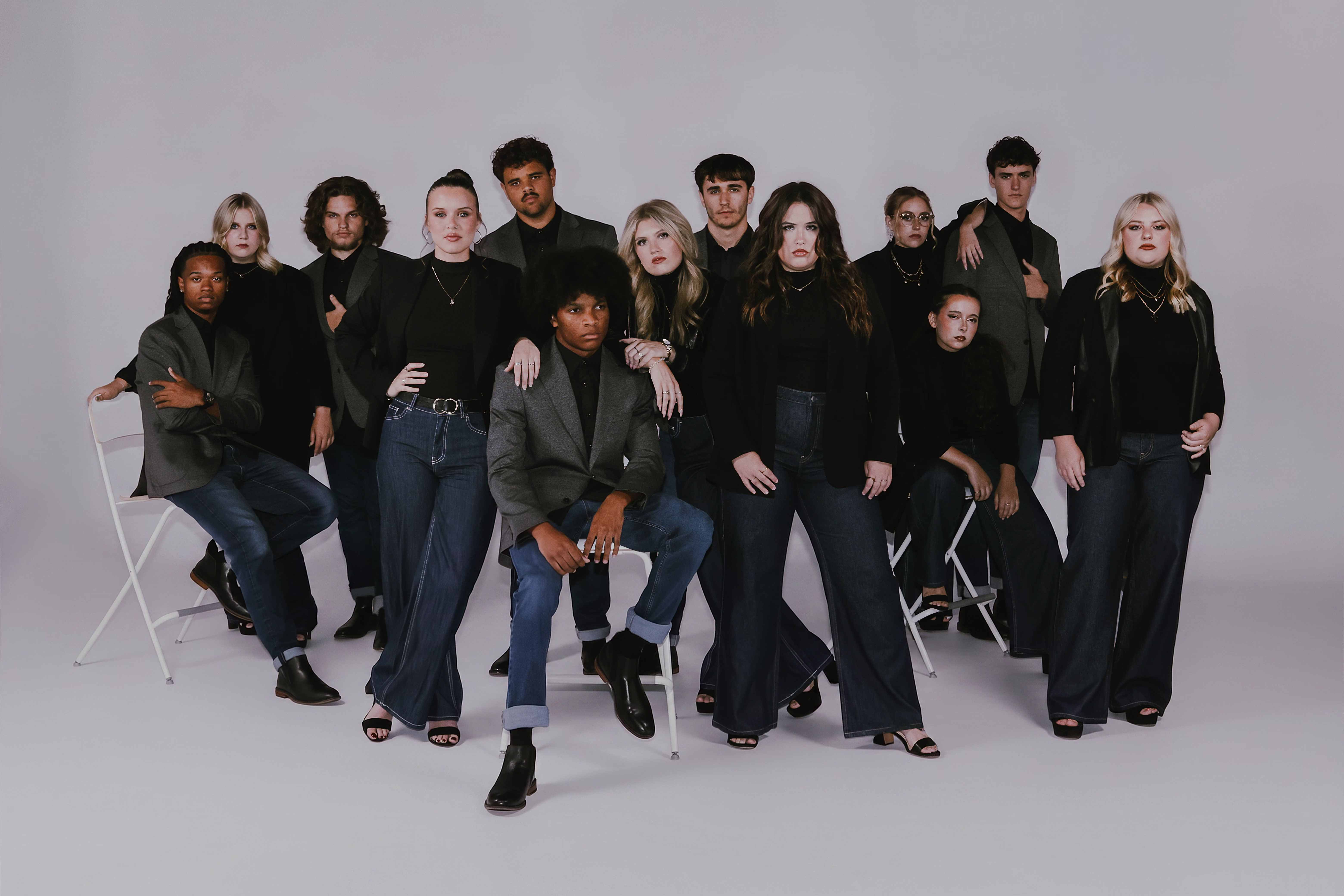 The members of Carolina Sound posed together in dark blazers and denim